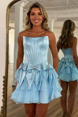 Trendy Strapless Ruffle Tiered Hoco Dress with Satin Bow Accents and Crystal Details