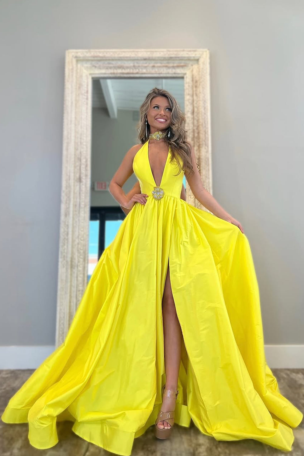 Elegant Yellow A-Line Satin Prom Gown with Deep V-Neckline and Beading